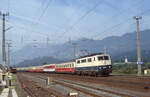 DB 111.059-2 unterwegs auf dem ÖBB Netz bei durchfahrt in Kundl am 13.09.1990, 10.18u. Mit Wagen der DB als EC-24  Erasmus  (Innsbruck Hbf - Amsterdam CS). Scan (Bild 5395, Kodak Ektachrome100HC).
