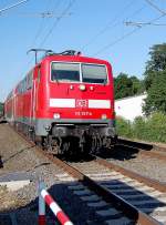 Die E 111 157-4 zieht am Donnerstag den 3.6.2010 eine Doppelstockeinheit der Linie RE 4 nach Aachen.