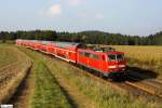 DB 111 057-6 im Sptnachmittags-Sonnenlicht vor RE 4263 Nrnberg - Mnchen, KBS 880 Nrnberg - Passau, fotografiert bei Dettenhofen am 28.09.2011 