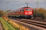 Nachschu auf einen RE4 Zug bei Bttgen am 10.10.2011, geschoben wird der Zug von der 111 156.......