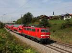 Die 111 023 mit einem RE nach Salzburg am 22.09.2013 unterwegs bei Stra.