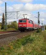Nachschu auf die schiebende 111 146-7, die einen RE4 hier durch Kleinenbroich nach Dortmund Hbf bringt. 9.11.2013