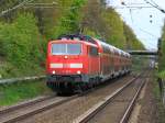 111 147-5 mit dem RE4 am Haken am 15.04.2014 auf der Rampe von Herzogenrath nach Kohlscheid.