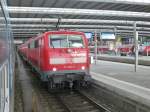 111 044-4 stand hier am 21.09.2014 mit einem Regionalexpress im Münchner Hbf.