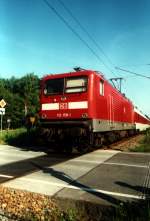 112 158 fhrt am Sptnachmittag des 9.7.2002 mit ihrem Nachtzug Richtung Sden aus dem Ostseebad Binz auf Rgen.