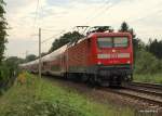 112 179-7 legt sich am 9.09.09 mit dem RE 21420 Hamburg Hbf - Lbeck Hbf kurz vor Ahrensburg in eine Rechtskurve.