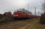 Hier 112 101 mit einem RE3 (RE18349) von Schwedt(Oder) Hbf. nach Wünsdorf-Waldstadt, bei der Ausfahrt am 3.2.2013 aus Schwedt(Oder) Hbf.