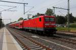 Die 112 113 mit dem RE 5 von Falkenberg (Elster) nach Stralsund Hbf am 06.05.2014 in Nassenheide.