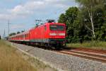 Am 01.08.2014 zieht die 112 152-4 den IRE 18539 von Rostock Hbf nach Berlin Hbf, hier bei der Durchfahrt in Nassenheide.