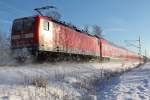 Der RE 5 von Stralsund nach Falkenberg (Elster) am 29.12.2014 in Nassenheide, geschoben von der 112 122.