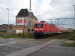 Am Bahnbergang Bahnhofstrae in Pasewalk entstand die Aufnahme,am 04.September 2010,als 114 023 den Bahnhof,mit dem RE 38349 Stralsund-Elsterwerda,verlie.