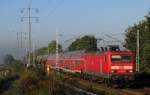 114 015-1 kommt am 11.10.2010 mit einem RE3 nach Wnsdorf-Waldstadt durch Diedersdorf gefahren.