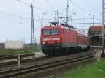 Ausfahrt fr RE 18315 Stralsund-Elsterwerda,gezogen von 114 018,am 14.Mai 2011,aus Pasewalk.