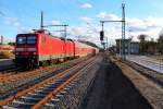 Die 114 005 mit dem RE 4360 aus Lutherstadt Wittenberg nach Rostock Hbf am 09.02.2014 in Nassenheide.