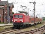 Am 10.05.2014 hielt die 114 003 von DB Regio Nordost, planmäßig mit Ihrem RE 18512 in Grimmen, um weiter in Richtung Stralsund zu fahren.