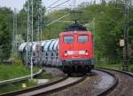 140 848-3 mit Gipszug am Bahnbergang Rimburg in richtung Aachen