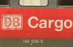 Die alten DB Cargo Aufschriften der 140 036-5 scheinen ihre beste Zeit hinter sich zu haben, aufgenommen am 10.04.2009 in Neuss Gbf