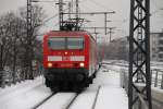 BERLIN, 06.02.2010, 143 911-6 als RE7 nach Wünsdorf-Waldstadt bei der Einfahrt in Berlin Hauptbahnhof