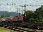 143 168-3 schiebt die RB12575 (Kln Hbf-Koblenz Hbf) am DB-Museum vorbei nach Koblenz Hbf.4.9.2010