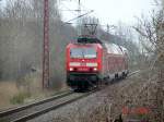 RE9 mit 143 210-3 aus Sassnitz nach Rostock Hbf kurz vor seinem nchsten Halt in Sagard. 30.4.06