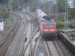 143 193 schob,am 10.April 2014,den RE 13031 Stralsund-Binz aus Bergen/Rügen.Aufgenommen von der Fussgängerbrücke.