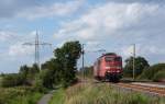 151 144-3 fuhr am 16.08.2012 als Lokzug von Emden nach Drpen, hier sdlich von Leer.
