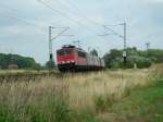 155 211 mit einem Containerzug bei Haste