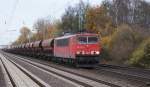 Mit einem langen gemischten Gterzug am Haken fuhr die 155 182-9 am 14.11.2009 durch den S-Bahnhof Dedensen/Gmmer.