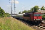 155 116-7 am 06. Juni  2011 vor einem Ganzzug mit Zementstaubsilowagen nach der Durchfahrt durch den Bahnhof Berlin Schnefeld Flughafen 