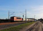 Die 701 der MEG mit Kalksilowagen bei der Durchfahrt in Nassenheide am 07.01.2014.