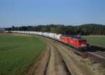 143 344 (MEG 605) + 155 119 (MEG 706) mit dem Zementzug am 13.03.2014 bei Dettenhofen.