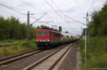 MEG 702 (155 179-5) Mitteldeutsche Eisenbahn GmbH mit einem Zementzug von Rüdersdorf nach Rostock-Seehafen, bei der Durchfahrt in Berlin-Hohenschönhausen. 24.07.2014 (Fotostandort: Bahnsteigende)
