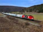 Die 156 002 mit einem Zementzug am 17.03.2012 unterwegs bei Harrbach.