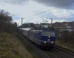 Die blaue 181 201-5 zieht den EN 453 Paris Est - Moskva am 17.12.2011 durch das franzsische Stiring-Wendel nach Saarbrcken Burbach wo Lokwechsel ist

