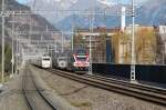 Begegnung eines IR Dosto nach Chur mit dem gerade ausfahrenden ICE nach Hamburg bei der Station Chur-Wiesental(man beachte die Spiegelung des ICE im IR Doppelstockzug)30.12.15