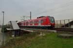 Aus dem HP Allerheiligen beschleunigt der 423 538-8 heraus in Richtung Neuss-Norf. Sonntag den 21.4.2013