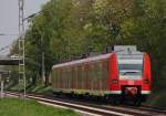 425 069-2 als RB11068 nach Duisburg am Km 25.8 der KBS485 kurz vor Geilenkirchen, 28.4.10