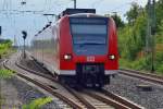 Aus Richtung Worms kommend ist hier eine RB 44 nach Mainz bei der Einfahrt in den Bahnhof Guntersblum......