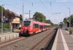 442 752 hielt am 17.7.14 als S1 nach Bamberg in Strullendorf vor dem immer noch besetzten Empfangsgebäude.