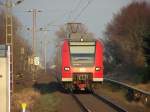 425 068/568 verlsst mit der Sonne im Rcken den HP Herrath in Richtung Mnchengladbach Hbf.