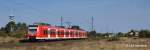 425 764-8 hat soeben Wiesental verlassen und rollt nun auf Graben-Neudorf zu. 24.09.11.