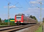 Ein RE8 Zug nach Mnchengladbach, der vom 425 523-8 gefhrt wird, ist hier bei Gubberath abgelichtet zu sehen. 18.4.2013