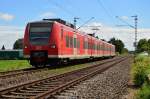In Richtung Jüchen fahrend ist hier der  425 038-5 bei Gubberath als RE8 nach Mönchengladbach unterwegs am Sonntag den 6.7.2014