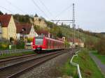 425 044-5 ist am 17. April 2015 als Leerreise von Haßfurt nach Schweinfurt Hbf bei Mainberg unterwegs.