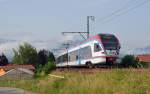 Am 02.07.12 war ET 131 der Berchtesgadener Landbahn auf dem Weg zum Bahnhof Freilassing, hier passiert der Triebwagen die Ortschaft Freilassing.