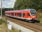 Flirt 429 026 kam am 15.September 2009 als RE 33216 Sassnitz-Rostock auf dem linken Gleis mir bei Bergen/Rgen entgegen.