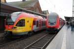 Hier ein Flirt der HLB neben einem Dost-Steuerwagen der DB am 14.12.2011 in Gieen.