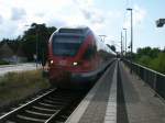 RE 13009 Rostock-Sassnitz,gefahren vom 429 027,hielt,am 28.August 2013,am Stralsunder Haltepunkt Grnhufe.