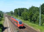 Der dreiteilige Talent-Regionalzug 442 144 fährt gerade am Stadion der Freundschaft (Cottbus) vorbei und erreicht in Kürze Cottbus Sandow. 7.6.2014