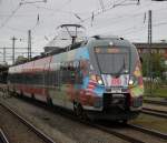 der halb fertige Werbehamster 442 854-6 als S3(Warnemnde-Gstrow)bei der Ausfahrt im Rostocker Hbf.10.05.2015